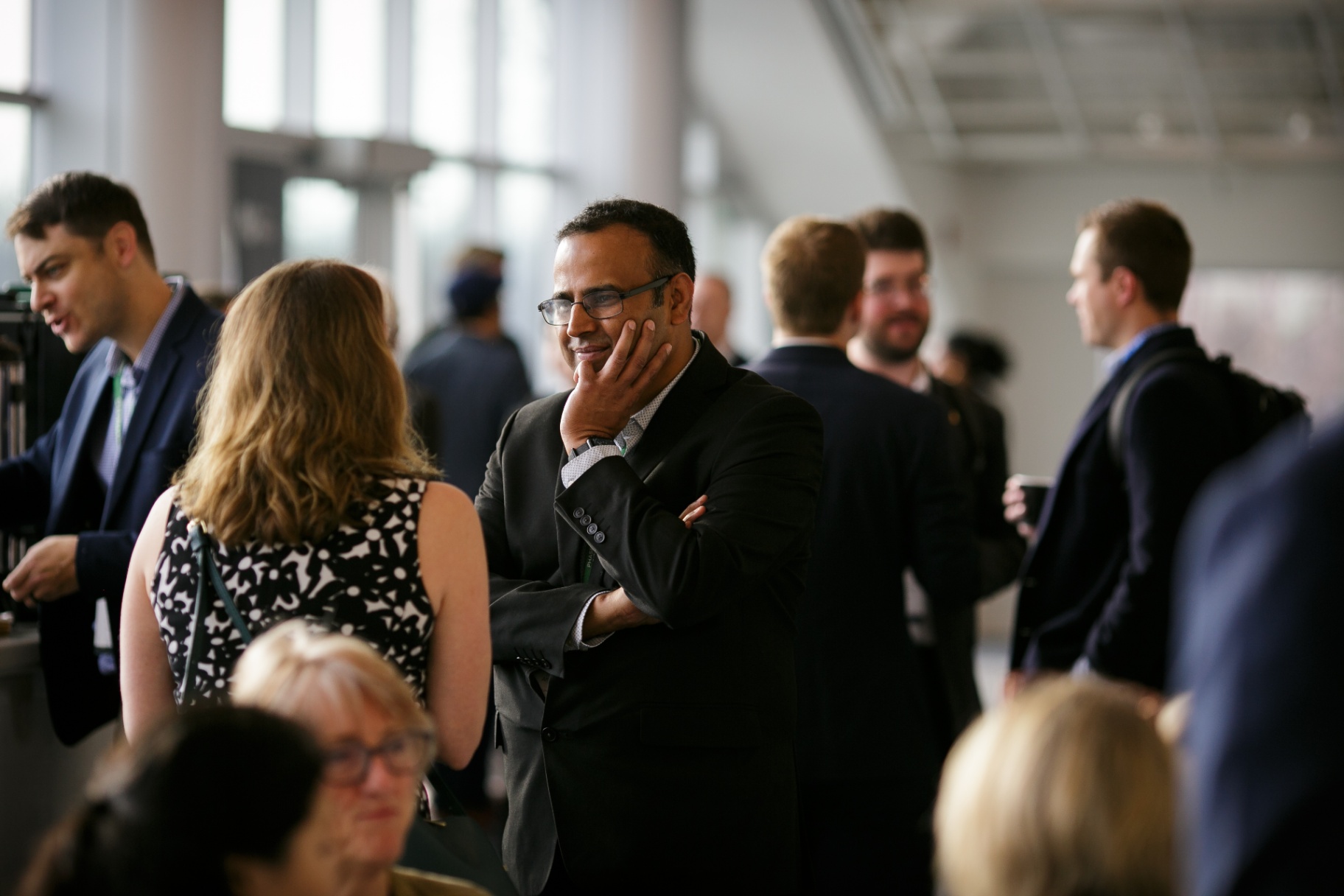 Attendees in conversation during a Frontiers 2026 networking break