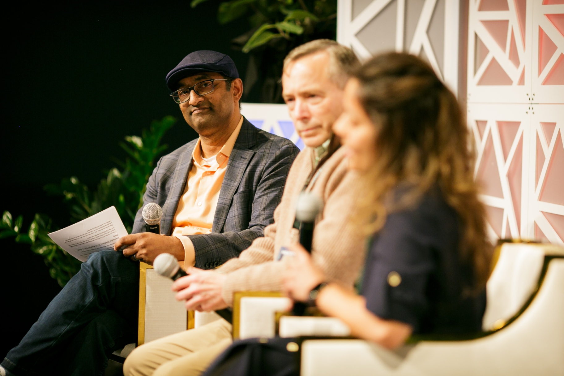 Panelists in conversation during a Frontiers fireside session